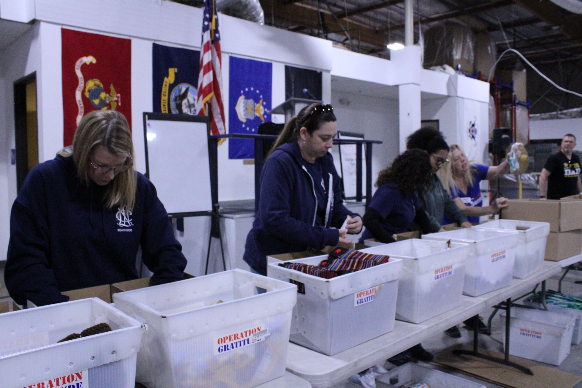 Volunteers assembling care packages