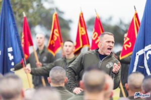 Marine standing in front of his troops giving an inspirational speech