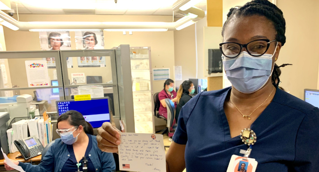 Frontline Responders smiling with handmade cards.