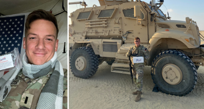 US Army Soldier standing in front of an Army vehicle holding an Operation Gratitude Care Package.