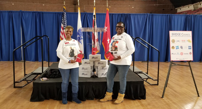 Gold Star Mothers and Operation Gratitude volunteers stand with care packages.