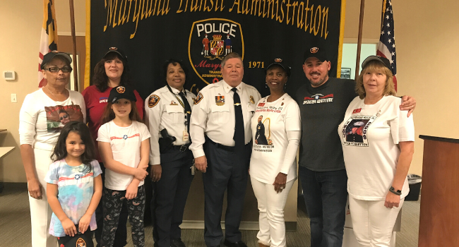 Gold Star Mothers, Operation Gratitude volunteers, and police officers stand together.