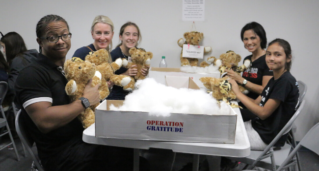 Volunteers quality control Battalion Buddy Bears.