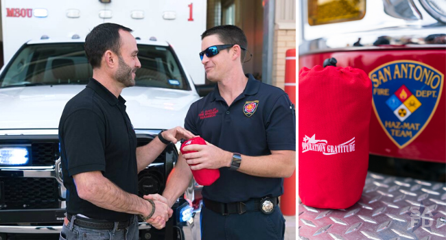 Volunteer shaking hands with firefighter.