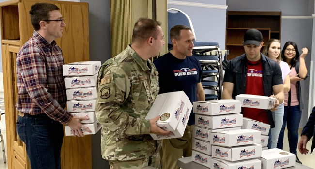 Operation Gratitude volunteers gather to assemble care packages for military and first responders.