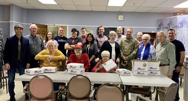 Operation Gratitude volunteers gather to deliver care packages to veterans.