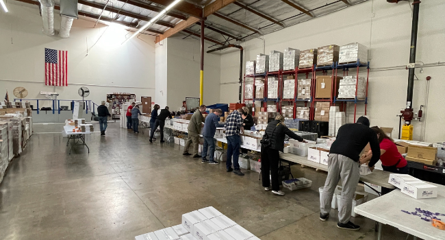 Operation Gratitude volunteers assembling care packages for deployed troops.