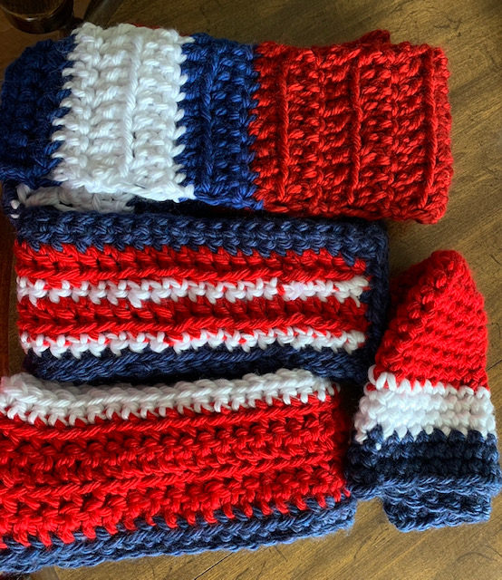 Handmade knit scarves and hats by volunteers.