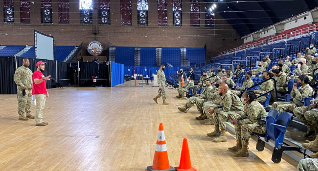 Operation Gratitude CEO talks to National Guard members and thanks them for their service.