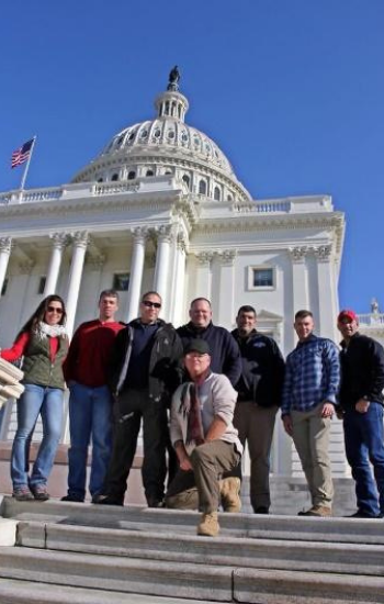 Group standing in front of the Capitol Building in DC.