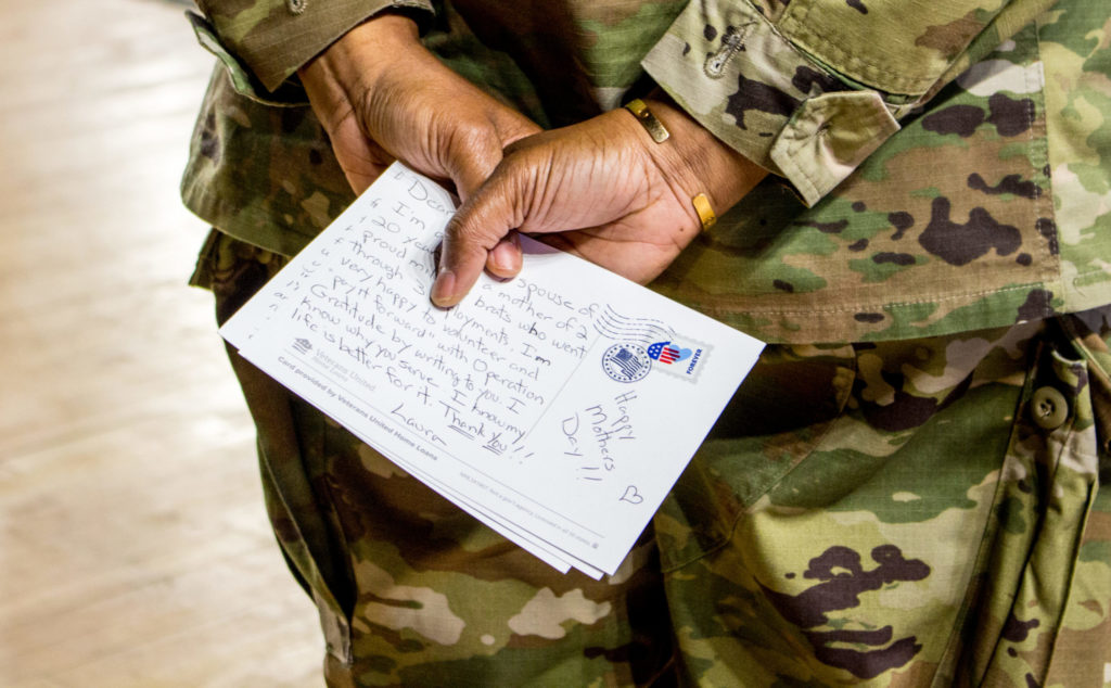 National Guardsman holds a letter of gratitude.