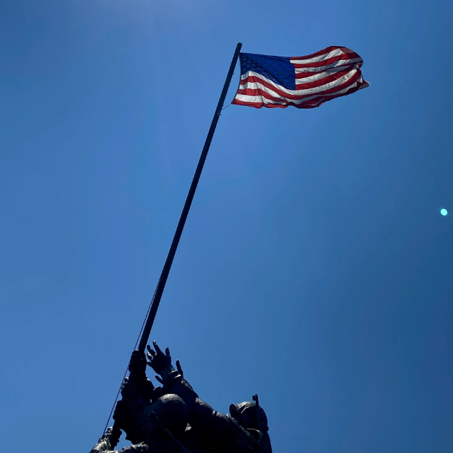 American flag flying high above the Iwo Jima Memorial.