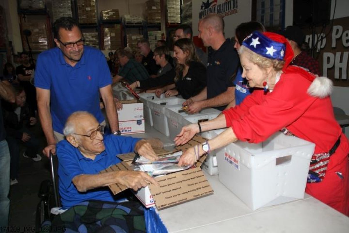 WWII Veteran and Operation Gratitude volunteer Steve Politis builds a milestone Care Package.
